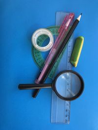 High angle view of blue paint on table