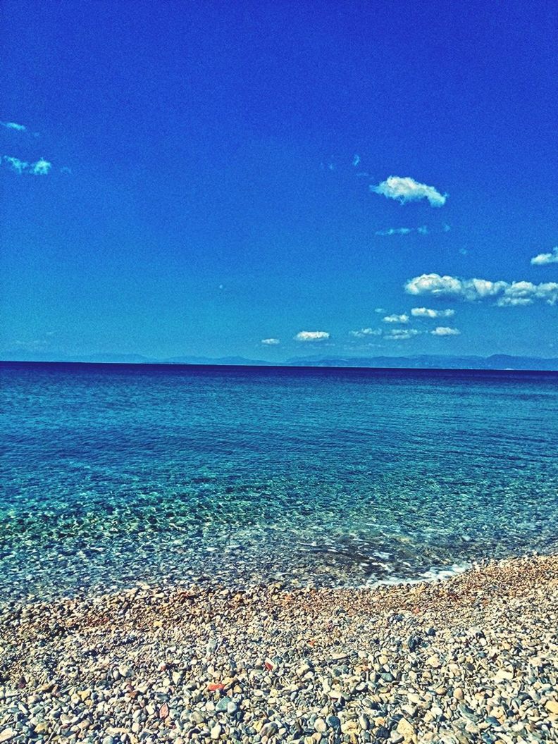 sea, water, blue, horizon over water, tranquil scene, scenics, tranquility, beauty in nature, sky, nature, beach, idyllic, seascape, copy space, shore, rippled, calm, remote, coastline, outdoors