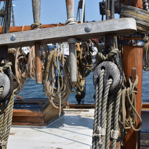 Close-up of rope tied to wooden post