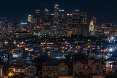 Illuminated buildings in city at night