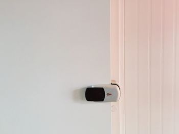 Close-up of futuristic lock on door at home