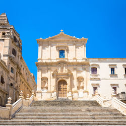 Low angle view of building against blue sky