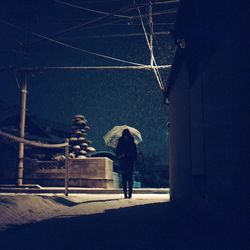 Full length of woman standing at night