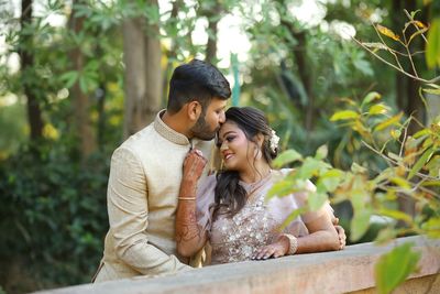 Young couple sitting outdoors