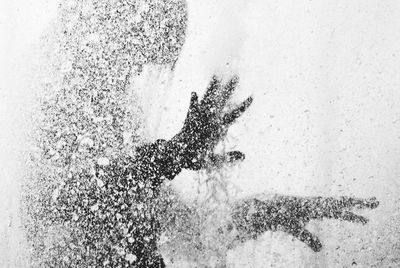 Close-up of a man in spraying water