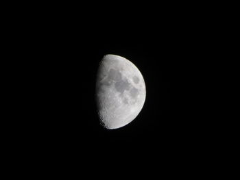 Low angle view of moon against sky at night