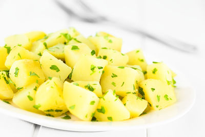 Close-up of chopped vegetables in plate on table