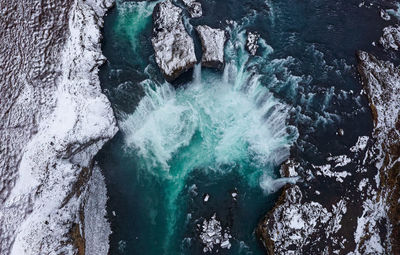 Aerial view of waterfall during winter