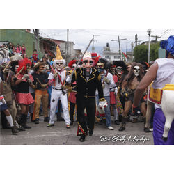 Group of people in traditional clothing standing on street