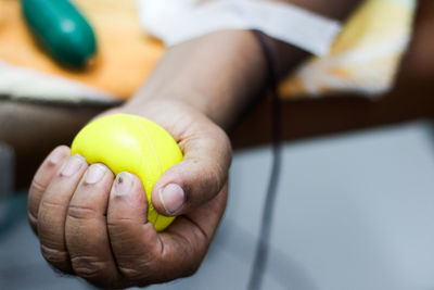 Close-up of hand holding ball