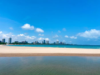 Scenic view of sea against blue sky