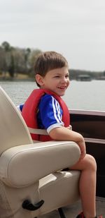 Boy sitting in boat