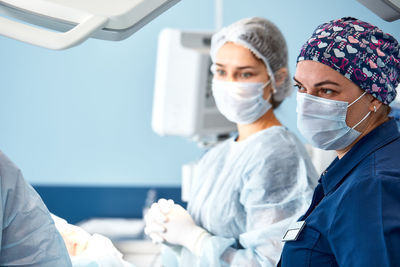 Midsection of scientist working in laboratory