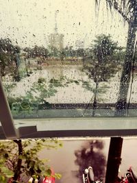 Raindrops on glass window of rainy season