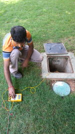 High angle view of boy on grass