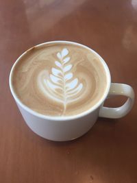 Close-up of cappuccino on table