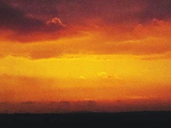 Scenic view of dramatic sky during sunset