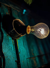 Close-up of wine bottles on glass