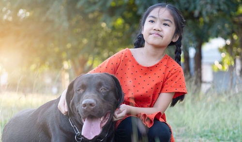 Portrait of cute girl with dog