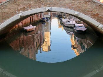 Boats moored in canal