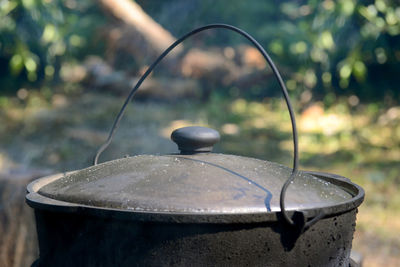 Close-up of old metal on table