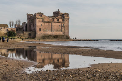 Reflection of building on beach