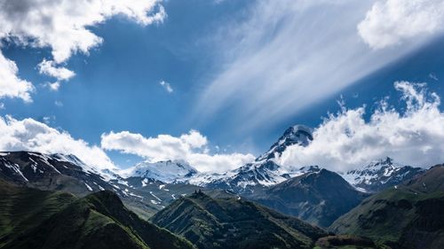 Scenic view of snowcapped mountains against sky