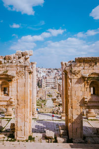 Old ruins of temple against cloudy sky