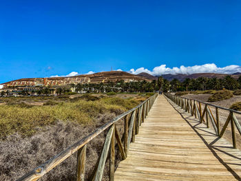 High angle view of bridge against clear blue sky