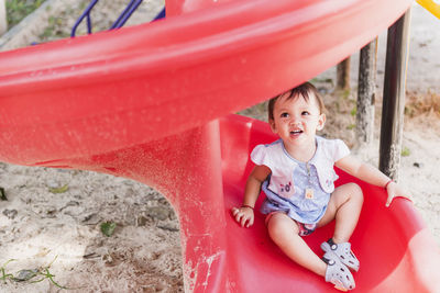 Portrait of happy boy playing in playground