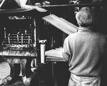 Rear view of man working