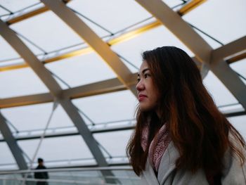 Portrait of young woman looking away