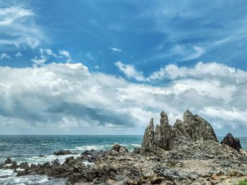 Scenic view of sea against blue sky