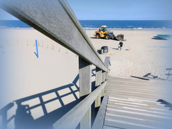 Man on beach against clear sky