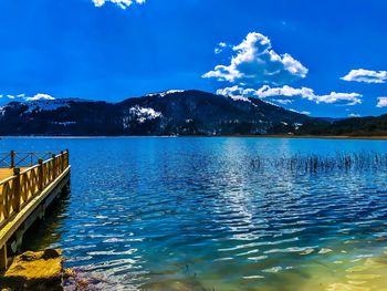 Scenic view of lake against blue sky