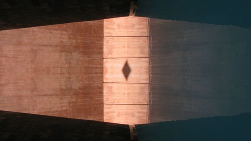 Wooden structure reflecting on water