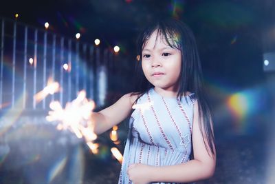 Child playing fireworks in new year celebration at night