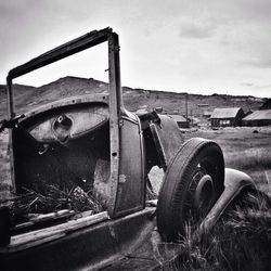 Old rusty truck on field