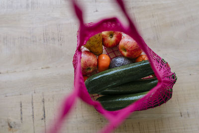 Eco friendly and reusable shopping mesh bag with fruits and vegetables