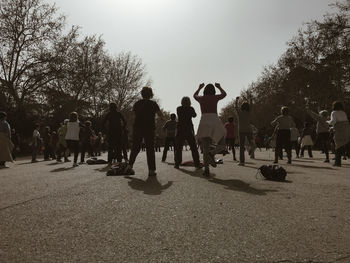 People on street against sky