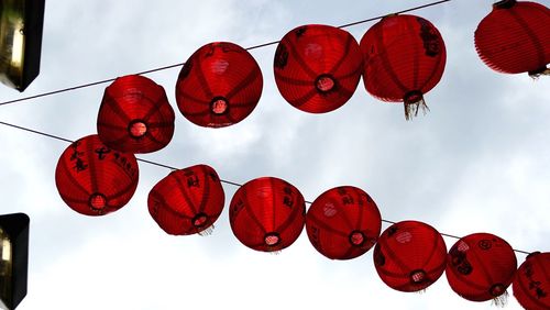 Low angle view of lanterns hanging in row