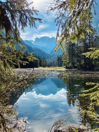 Scenic view of lake and mountains against sky