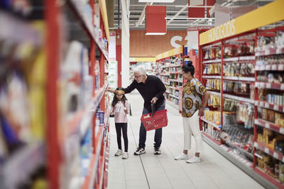 Family doing shopping in supermarket