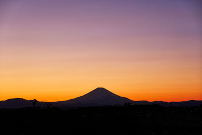 Scenic view of silhouette landscape against sky during sunset