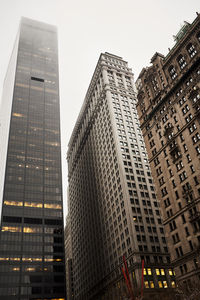 Low angle view of modern buildings against clear sky