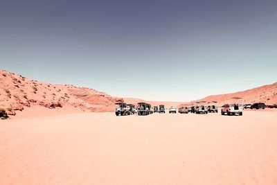 Cars parked at antelope canyon against clear sky