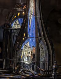 City reflected in metal bottle