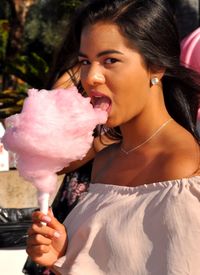 Portrait of woman eating ice cream