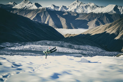 Young man against mountains on snow