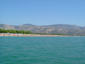 Scenic view of sea against clear blue sky